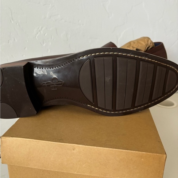 Brand new Men’s Cole Haan slip on dress shoes. Never worn.